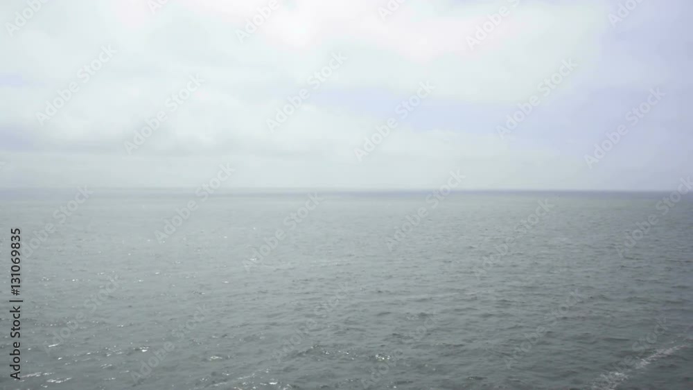 Open calm sea during a slightly hazy day in summer. Open calm sea during a slightly hazy day in summer.