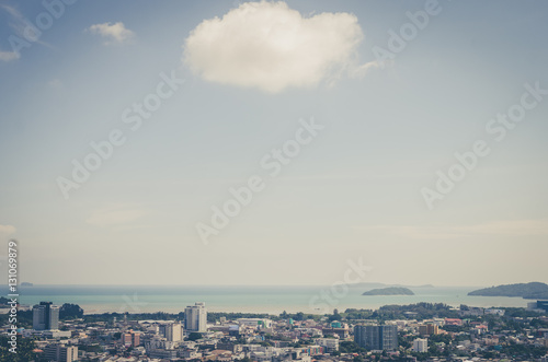 Copy space of top view Phuket town Thailand with white clouds and beach background.