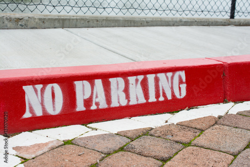 Painted red curb with no parking 
