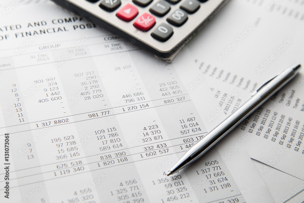 Pen, calculator On the financial account documents. Financial co Pen, calculator On the financial account documents. Financial co