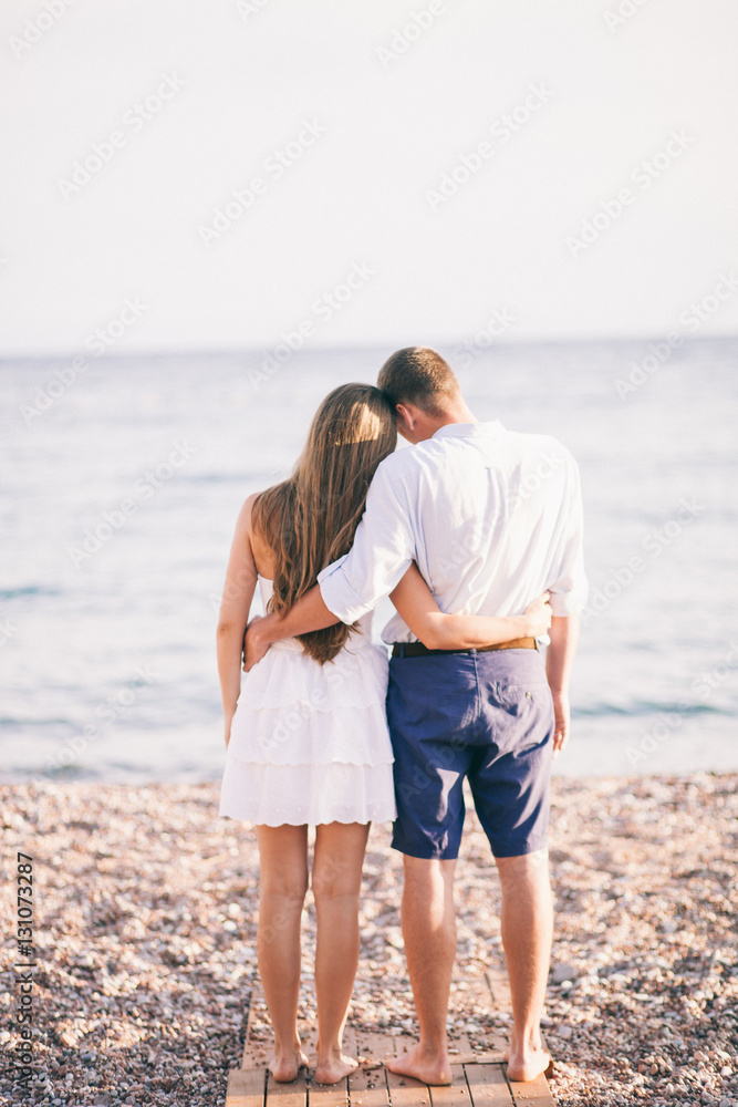 couple relax on beach together