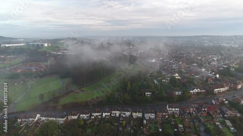 Panning aerial view of low cloud over an English street. photo