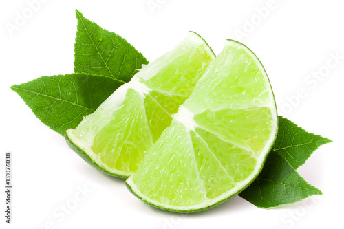 slices of lime with leaves isolated on white background