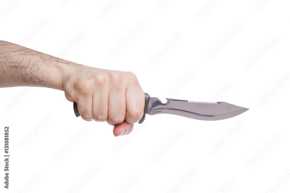 Hand holding a hunting knife in a stabbing gesture isolated on white background Hand holding a hunting knife in a stabbing gesture isolated on white background