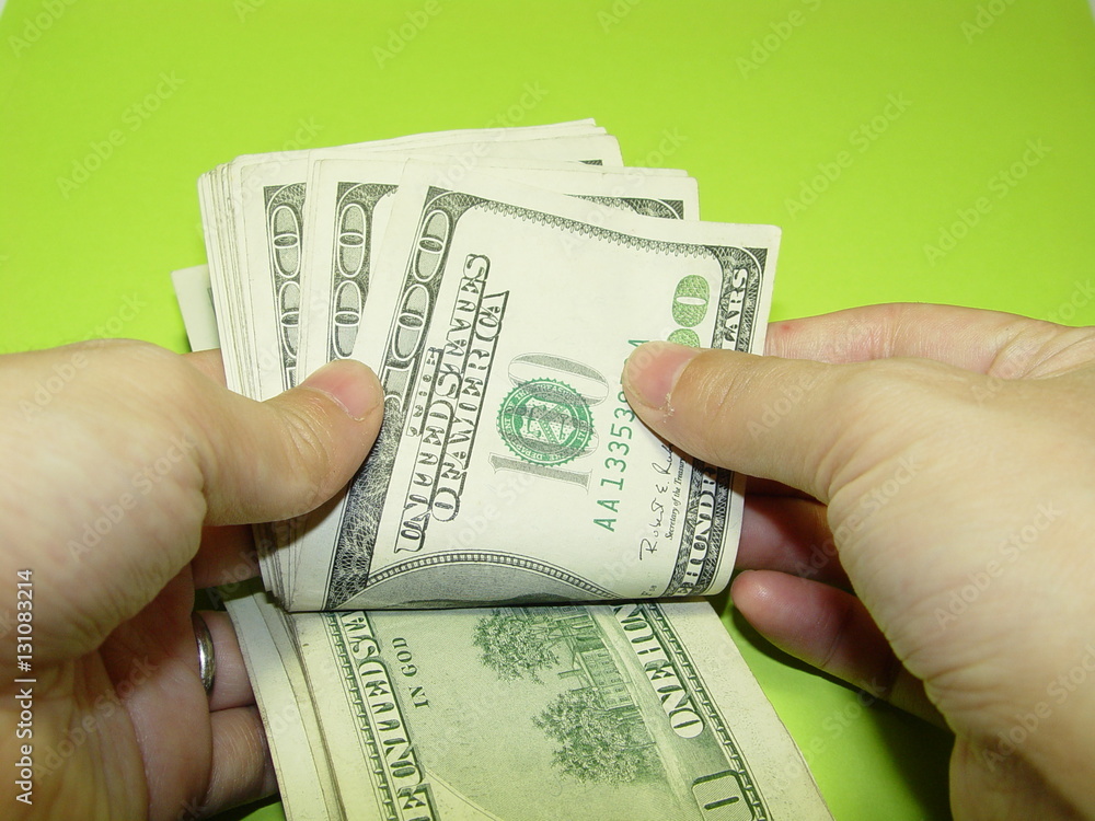 Counting money. 100 dollars. Cold hard cash. One hundred dollar bills