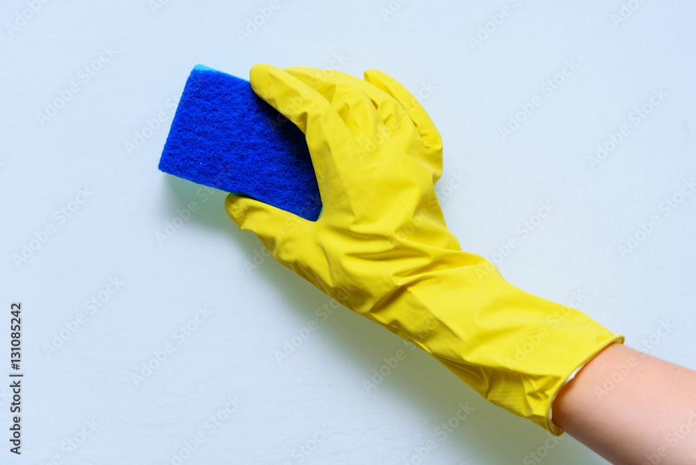 Wash the surface. Hand in yellow glove with sponge. Wash the surface. Hand in yellow glove with sponge.
