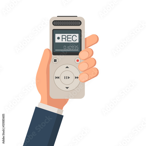 Journalist hand holds dictaphone
