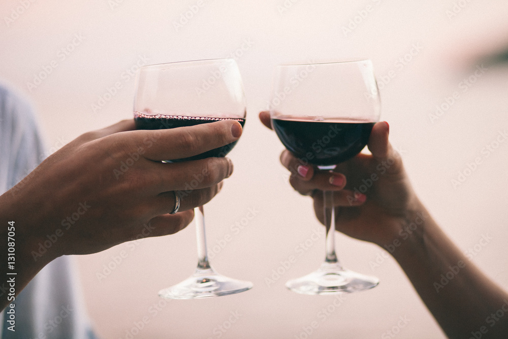 couple drink wine at sunset beach