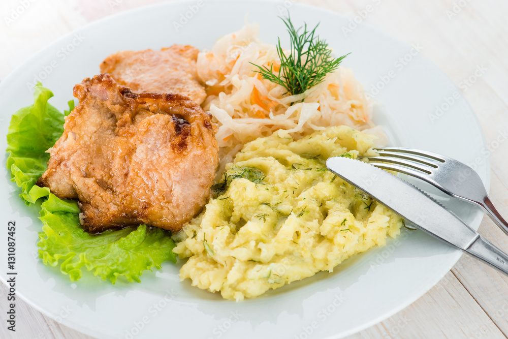 Russian homemade dish: mashed potatoes, chicken and cabbage sala Russian homemade dish: mashed potatoes, chicken and cabbage sala