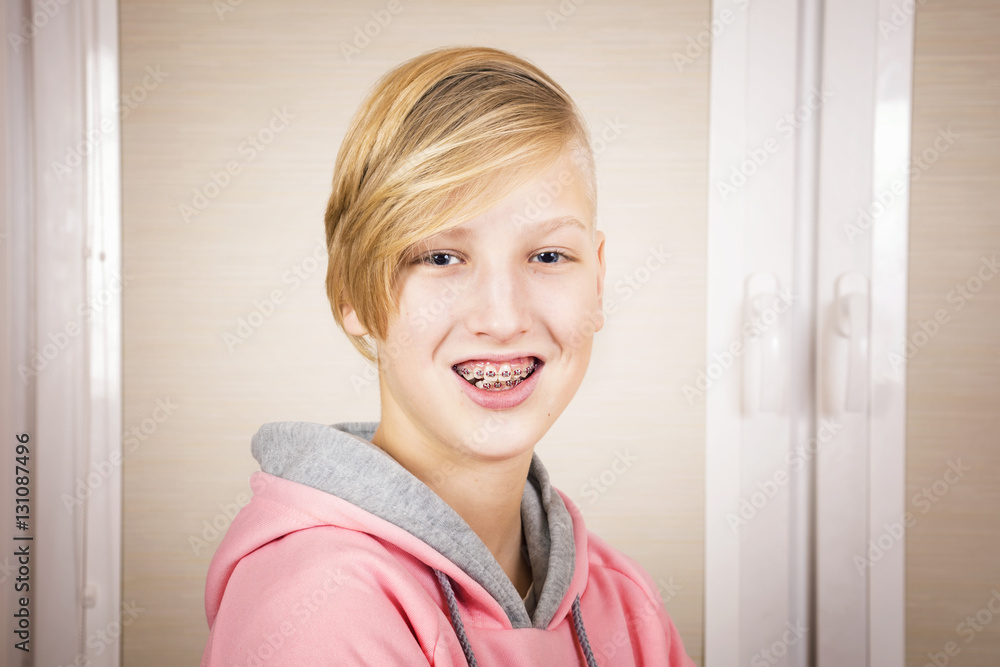 Teen with braces on his teeth. Orthodontics and bite correction. Teen with braces on his teeth. Orthodontics and bite correction.