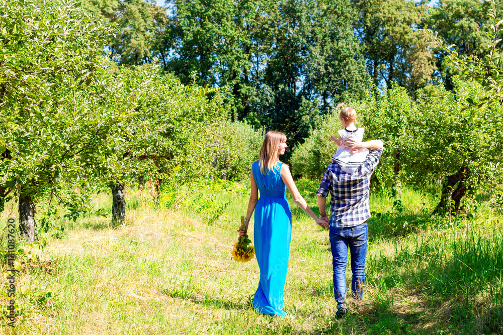 Fototapeta premium Happy family walking together