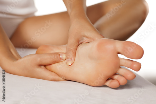 woman massaging her tired feet © vladimirfloyd