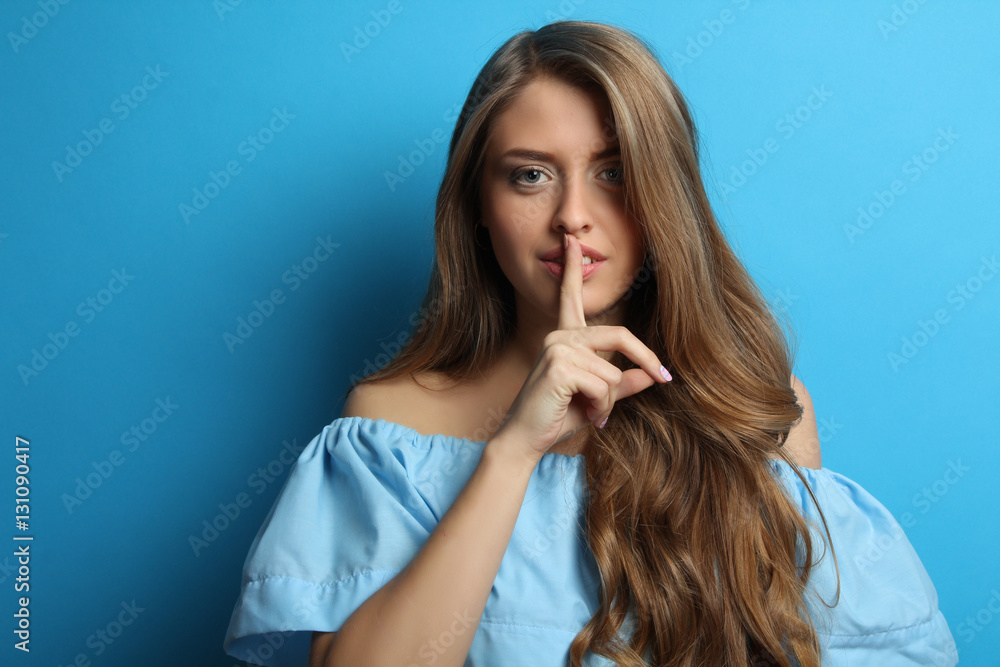 Beautiful girl with long wavy hair in the studio. Professional hair and make-up. Beautiful girl with long wavy hair in the studio. Professional hair and make-up.