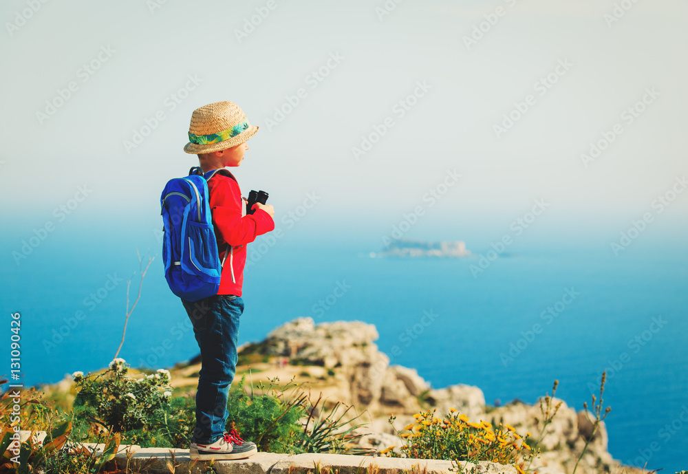 little boy hiking in mountains, kids travel