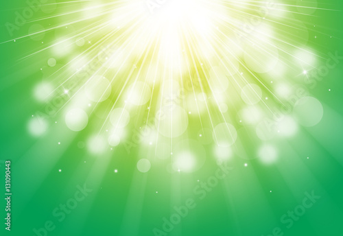 Green glitter sparkles defocused rays lights drop bokeh radial abstract background/texture.