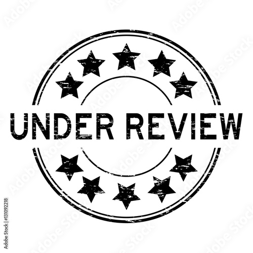 Grunge black under review with star icon round rubber stamp