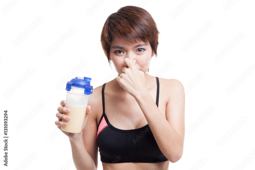 Beautiful Asian healthy girl hate whey protein smell. Beautiful Asian healthy girl hate whey protein smell.