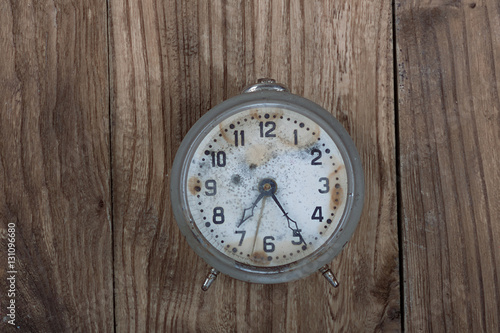 vintage watches, old alarm clock on a wooden background