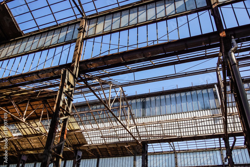 Wallpaper Mural Industrial interior of an old factory building with blue sky Torontodigital.ca
