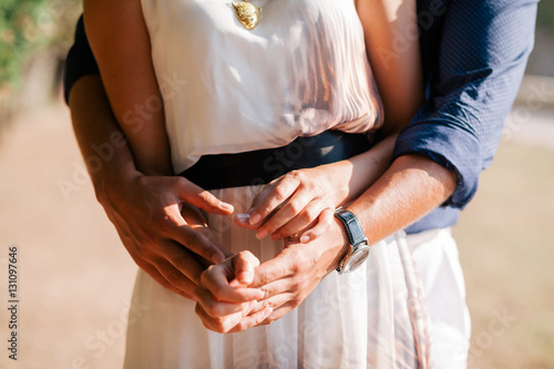 engaged couple hug