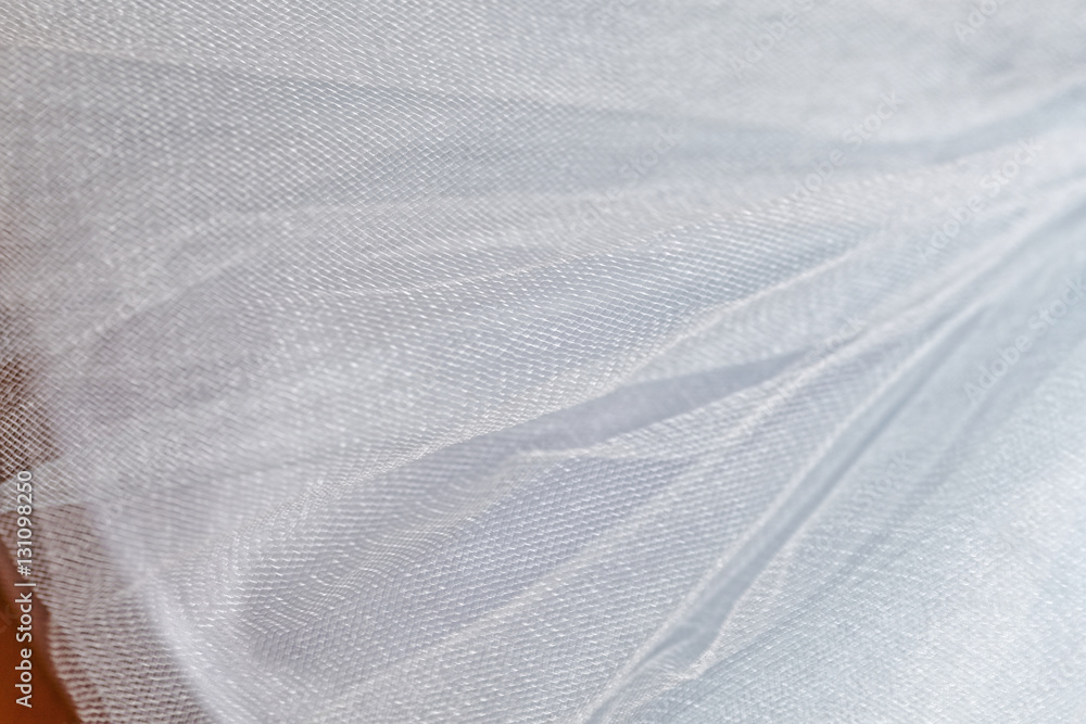 Macro view of sewing dresses. Close Up of fabric mesh for Tutu. Children's dance skirt. Net wedding textile. Macro view of sewing dresses. Close Up of fabric mesh for Tutu. Children's dance skirt. Net wedding textile.