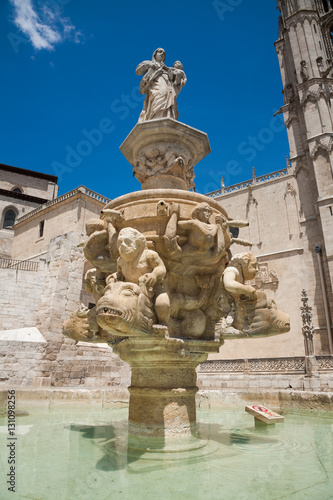 sculpture in fountain next to facade landmark of famous gothic catholic cathedral St Mary or Santa Maria, monument from XIII Century, in Burgos city, Castile, Spain Europe 