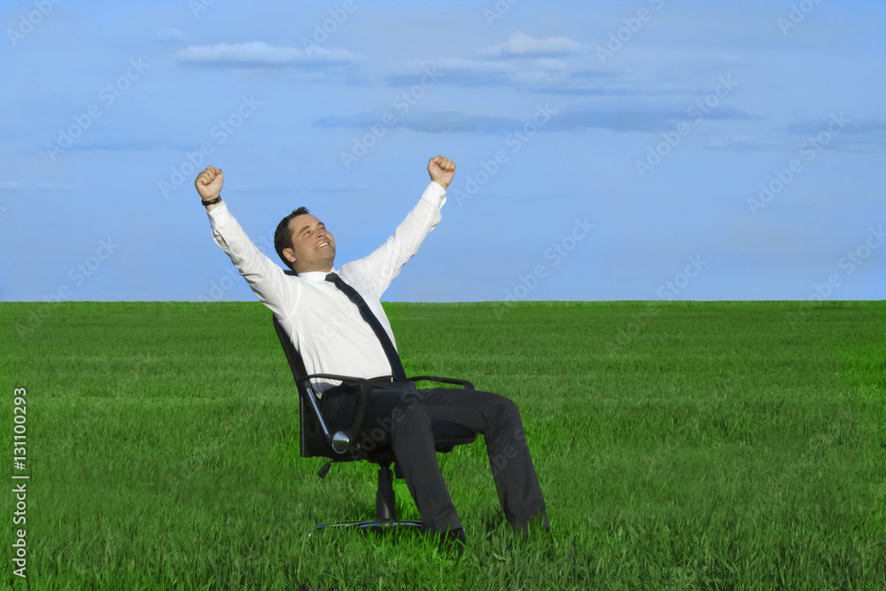 businessman take energy from nature in the meadow with dark blue businessman take energy from nature in the meadow with dark blue