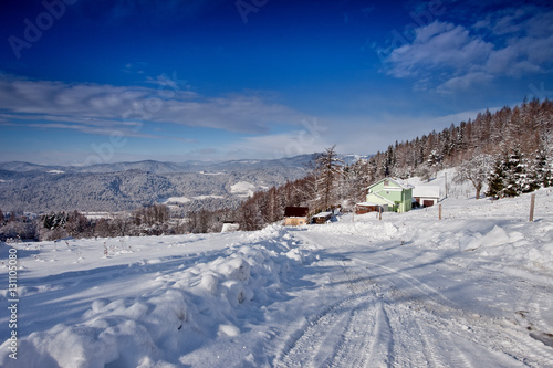 Słoneczny zimowy dzień w górskim mieście Muszyna. Sunny winter day in the mountain in Muszyna - Poland. Polish mountain landscape 