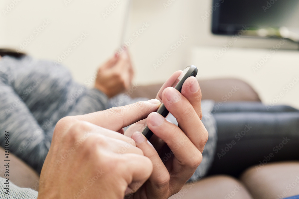 man and woman using electronic devices man and woman using electronic devices