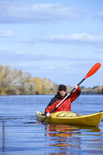Traveling by kayak on the river on a sunny day.