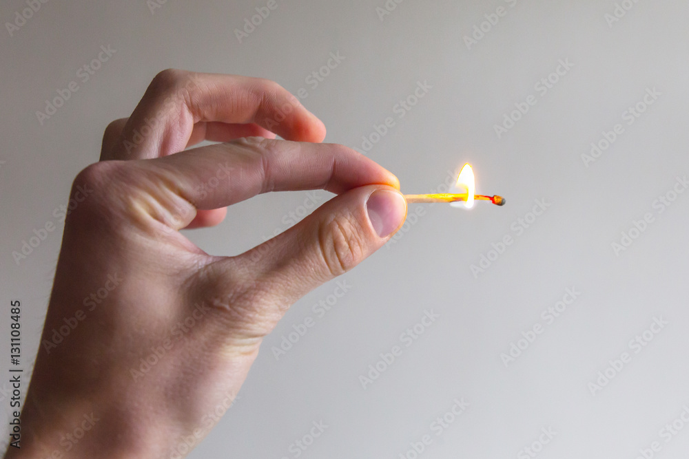 man hand gesture with fire match man hand gesture with fire match