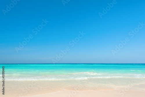 Beautiful blue sea and clear sky  Breathtaking tropical beach with white sandy and ripple wave