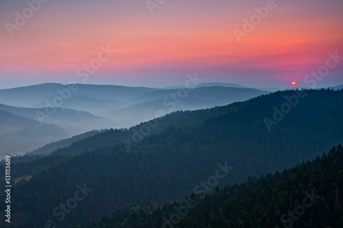 Piękny wschód słońca w górskim mieście Muszyna. Beautiful sunrise in the mountain in Muszyna - Poland. Polish mountain landscape.