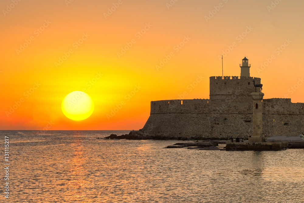 The sunrise at the old port of Rhodes, Greece
