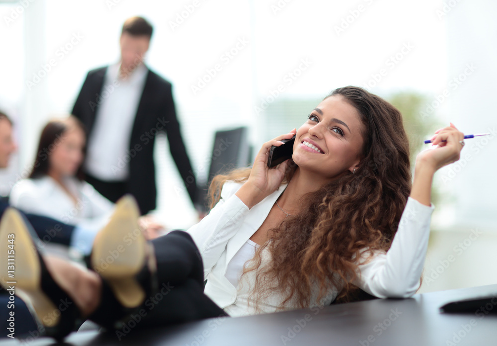 break in work. beautiful assistant girl talking on the phone and break in work. beautiful assistant girl talking on the phone and