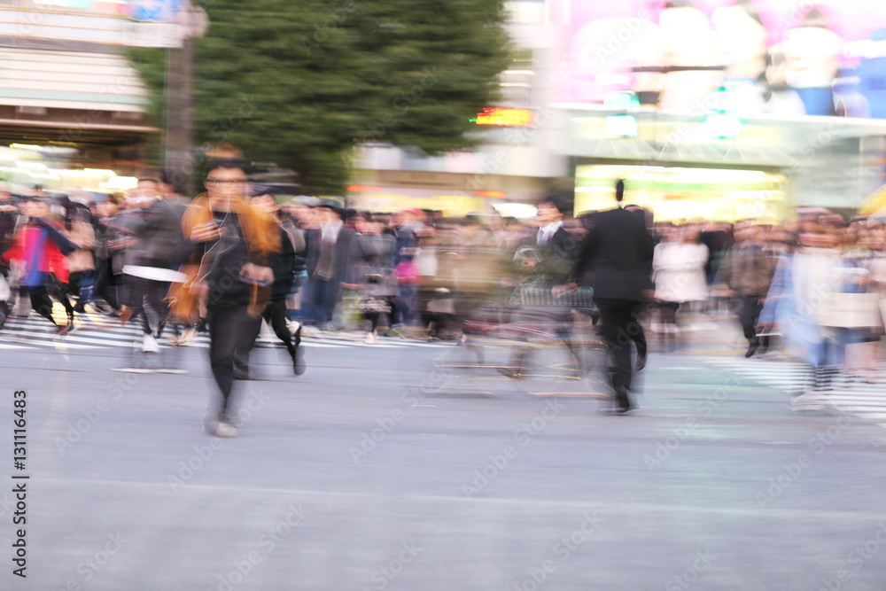Abstract blur crowd people on crosswalk at Shibuya town in Tokyo, Japan