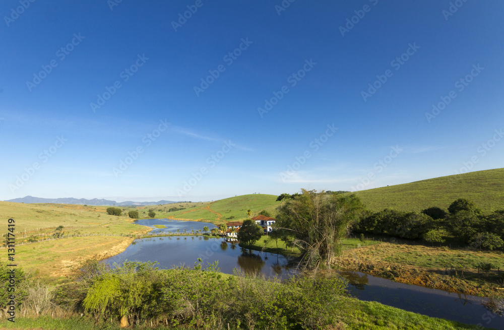 Naklejka premium Old farm in brazilian rural landscape