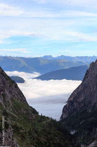 Valley Fischleintal, clouds and mountains in Sexten Dolomites, South Tyrol, Italy