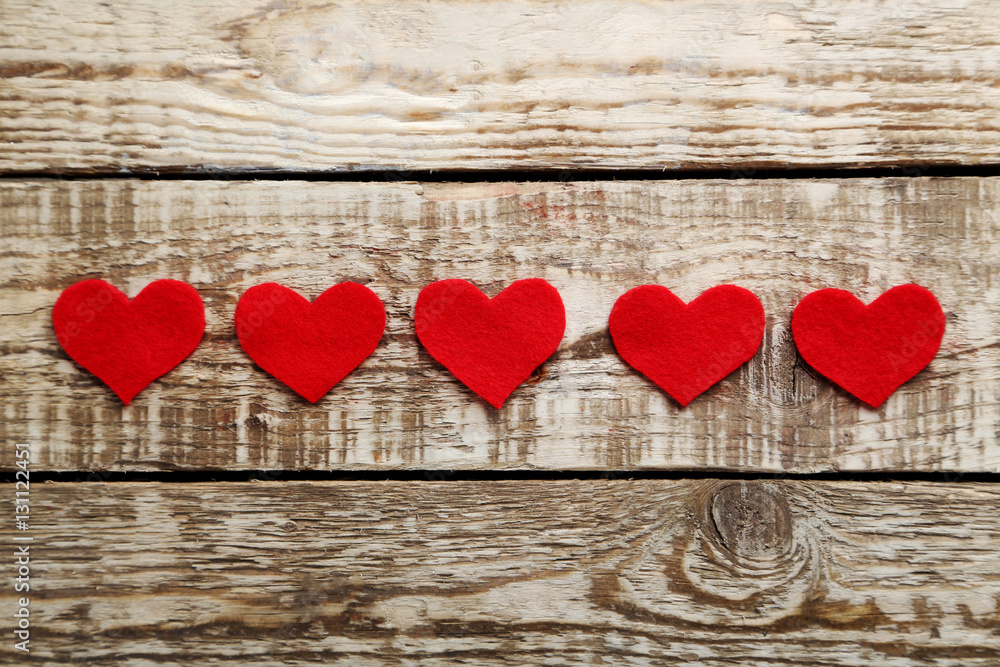 Love hearts on a grey wooden table Love hearts on a grey wooden table