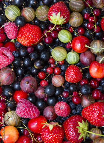 Fototapeta Naklejka Na Ścianę i Meble -  Berry background with fresh raspberries, blueberries, currants, strawberries, cherries,