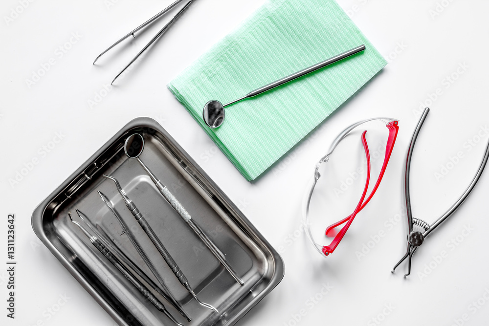 dentists tools in cabinet on white desktop top view dentists tools in cabinet on white desktop top view