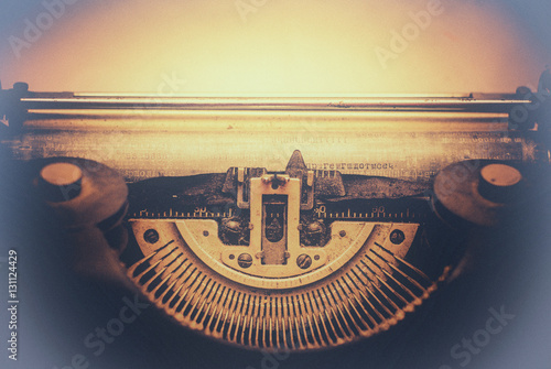 old typewriter with paper toned with a retro vintage filter effect photo