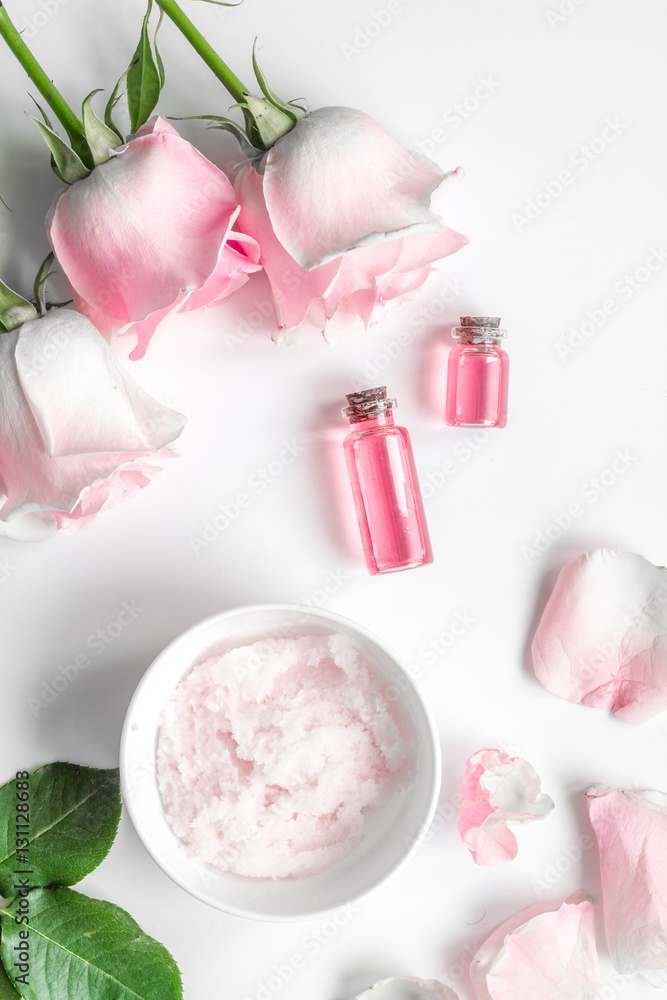organic cosmetic with rose oil on white background top view organic cosmetic with rose oil on white background top view