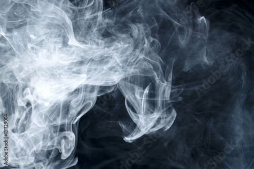 Abstract smoke Weipa. Personal vaporizers fragrant steam. The concept of alternative non-nicotine smoking. Blue smoke on a black background. E-cigarette. Evaporator. Taking Close-up. Vaping.