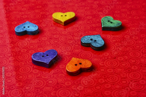 Symbolic hearts on red background