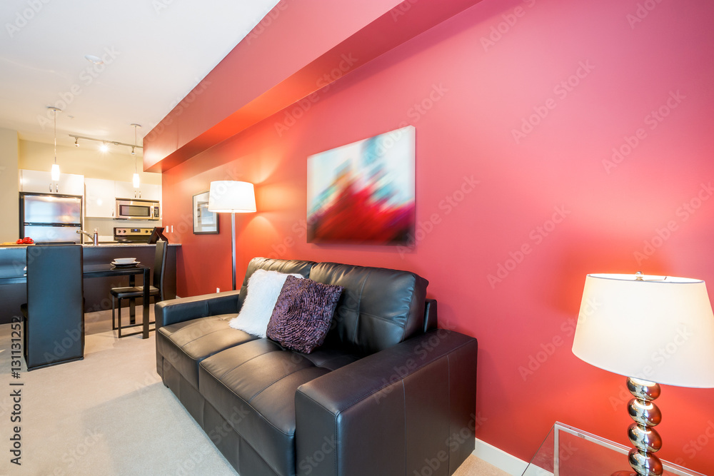 Fototapeta premium Modern bright, red living room and kitchen with dining room in a luxury house. Interior design.