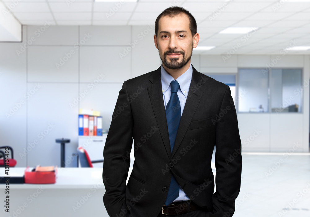 Portrait of an handsome businessman in his office Portrait of an handsome businessman in his office
