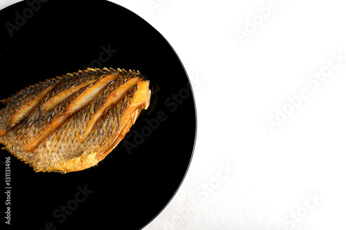 fish fry on black plate ,Tilapia Fish,planil.