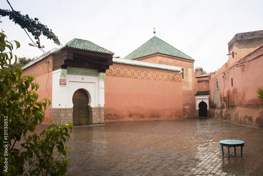 A typical square with red buildings in the center of Marrakesh in Morocco
