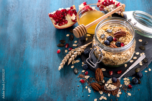Granola with berries, nuts, cereals and seeds, healthy breakfast concept
